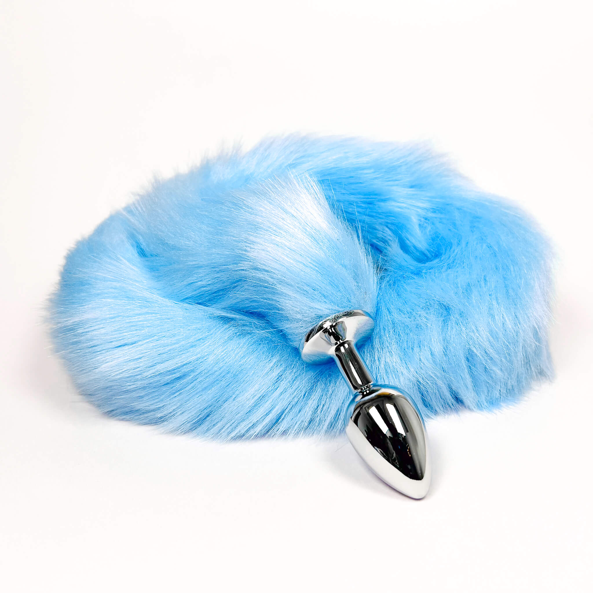 Blue fluffy tail with a metallic butthole plug on a white background