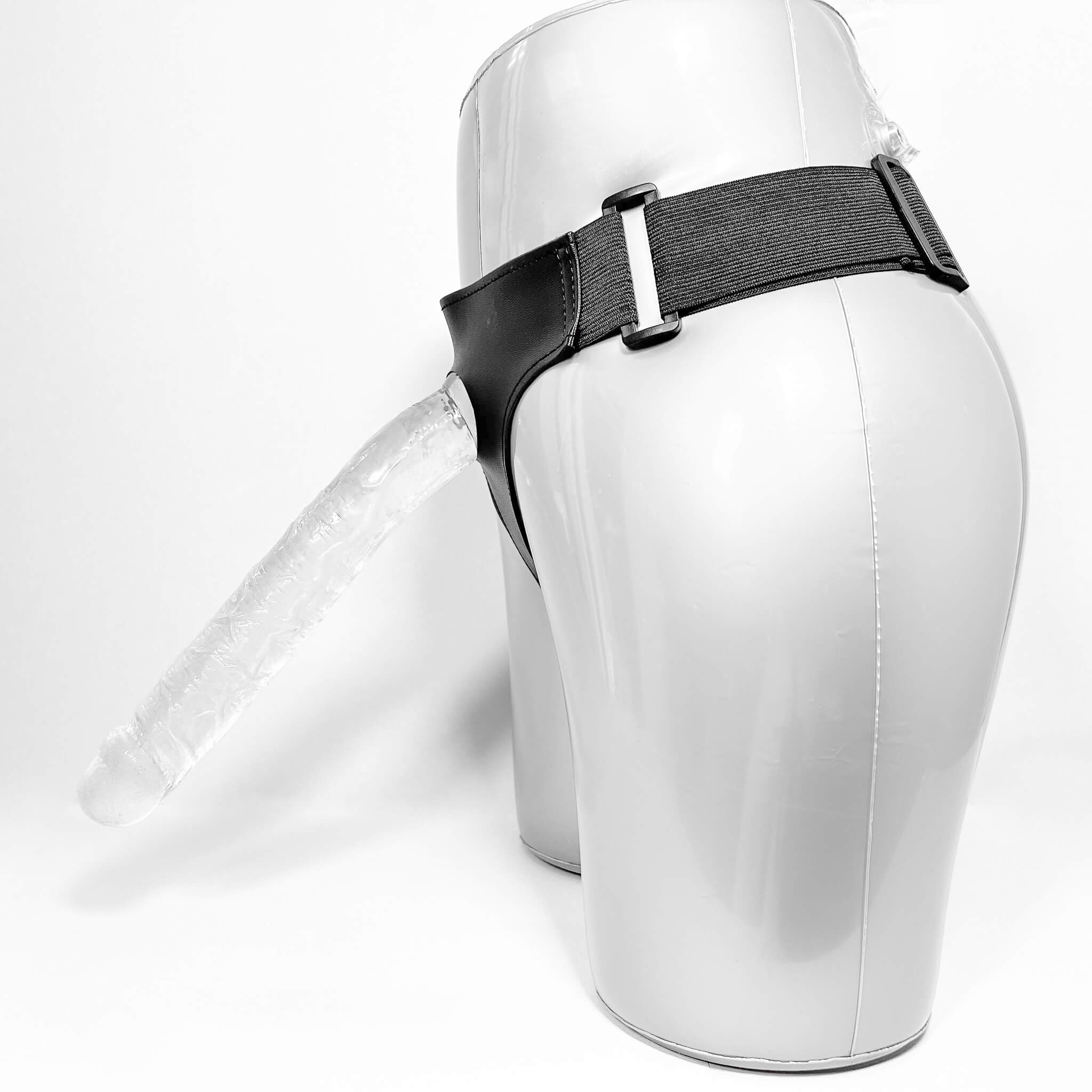 long strap-on dildo on a white background