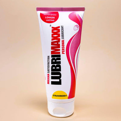 lubrimaxx Lubricant tube with red and white design on a beige background