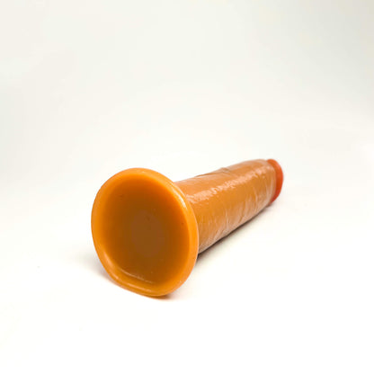 medium realistic dildo on a white background