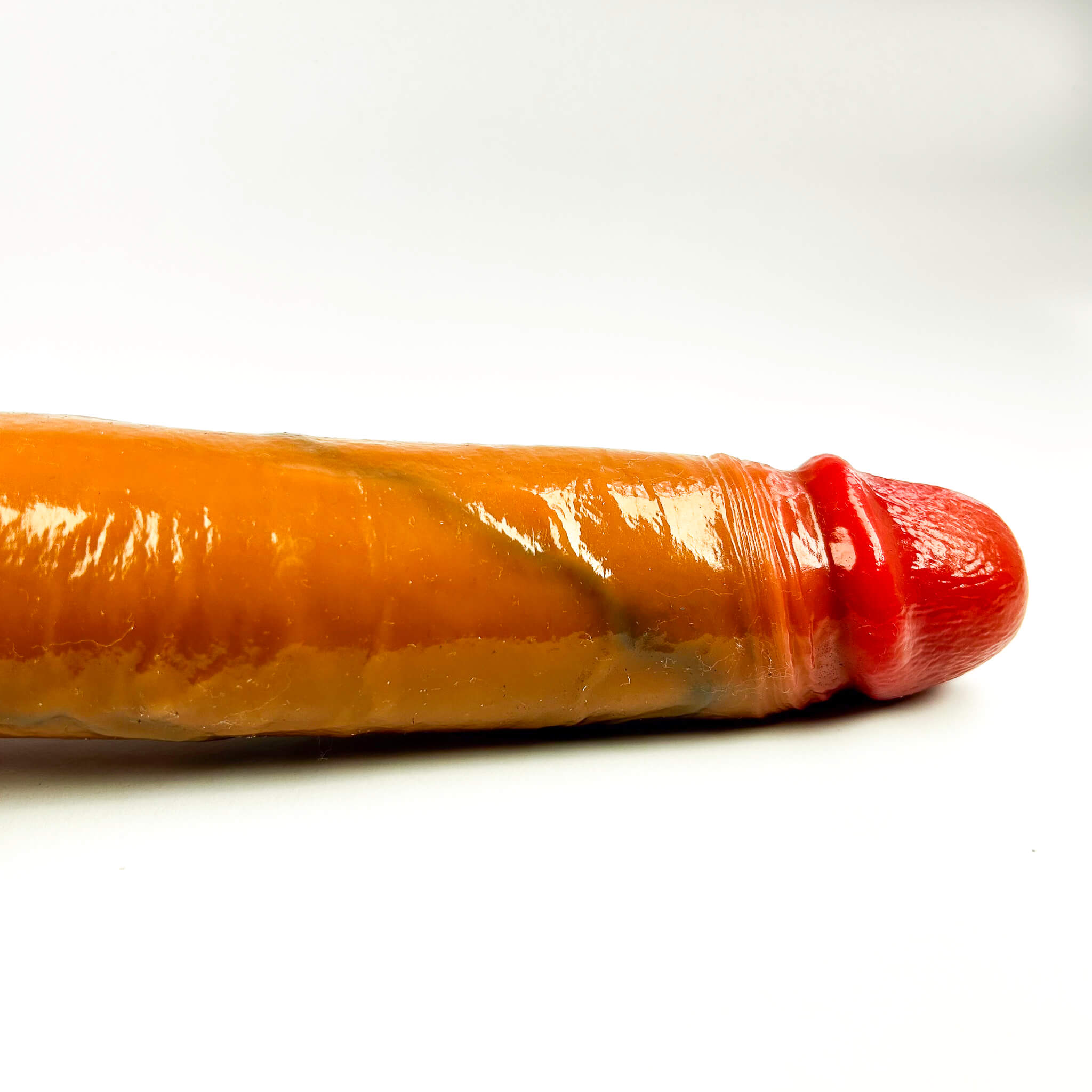 realistic cock dildo on a white background