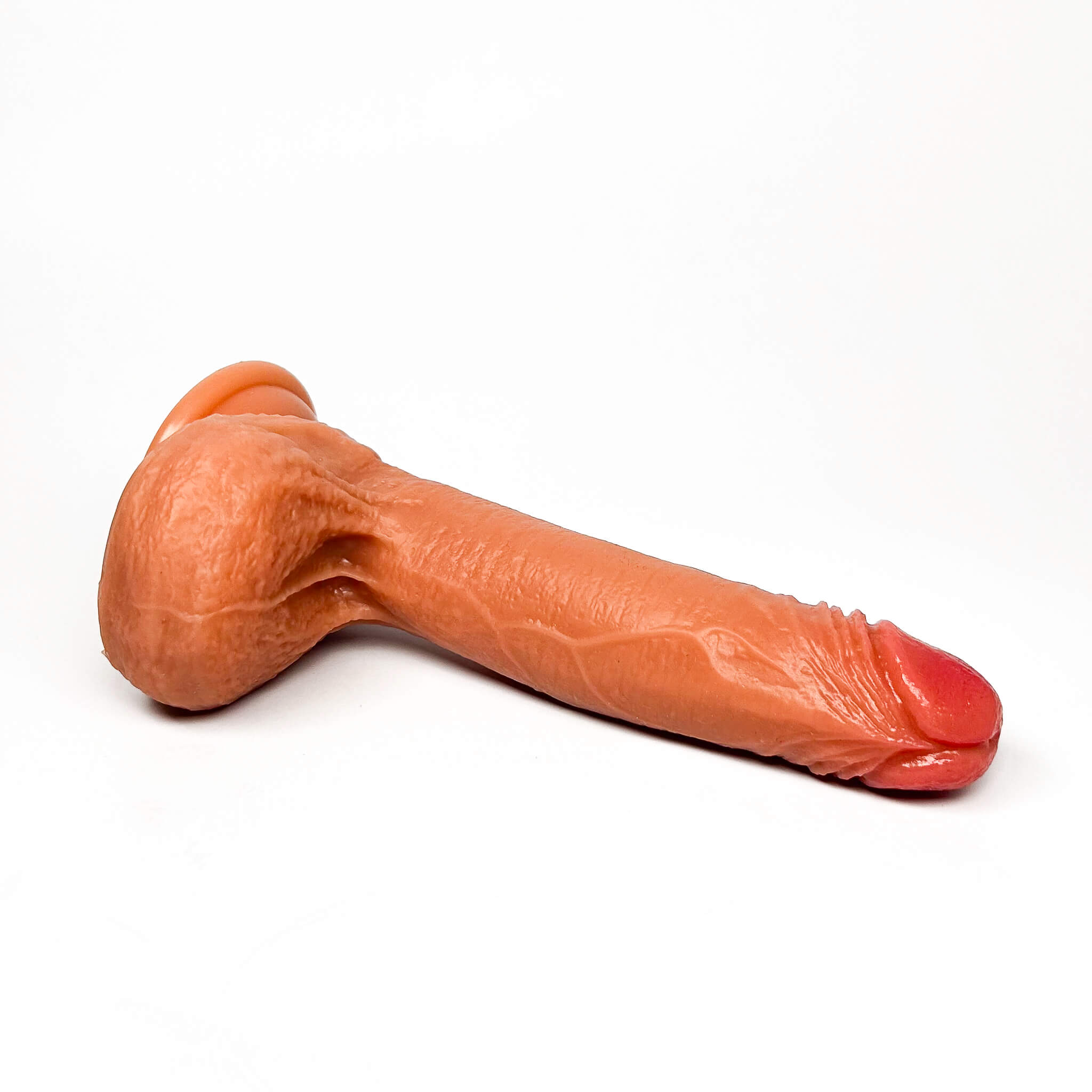 realistic feeling dildo on a white background