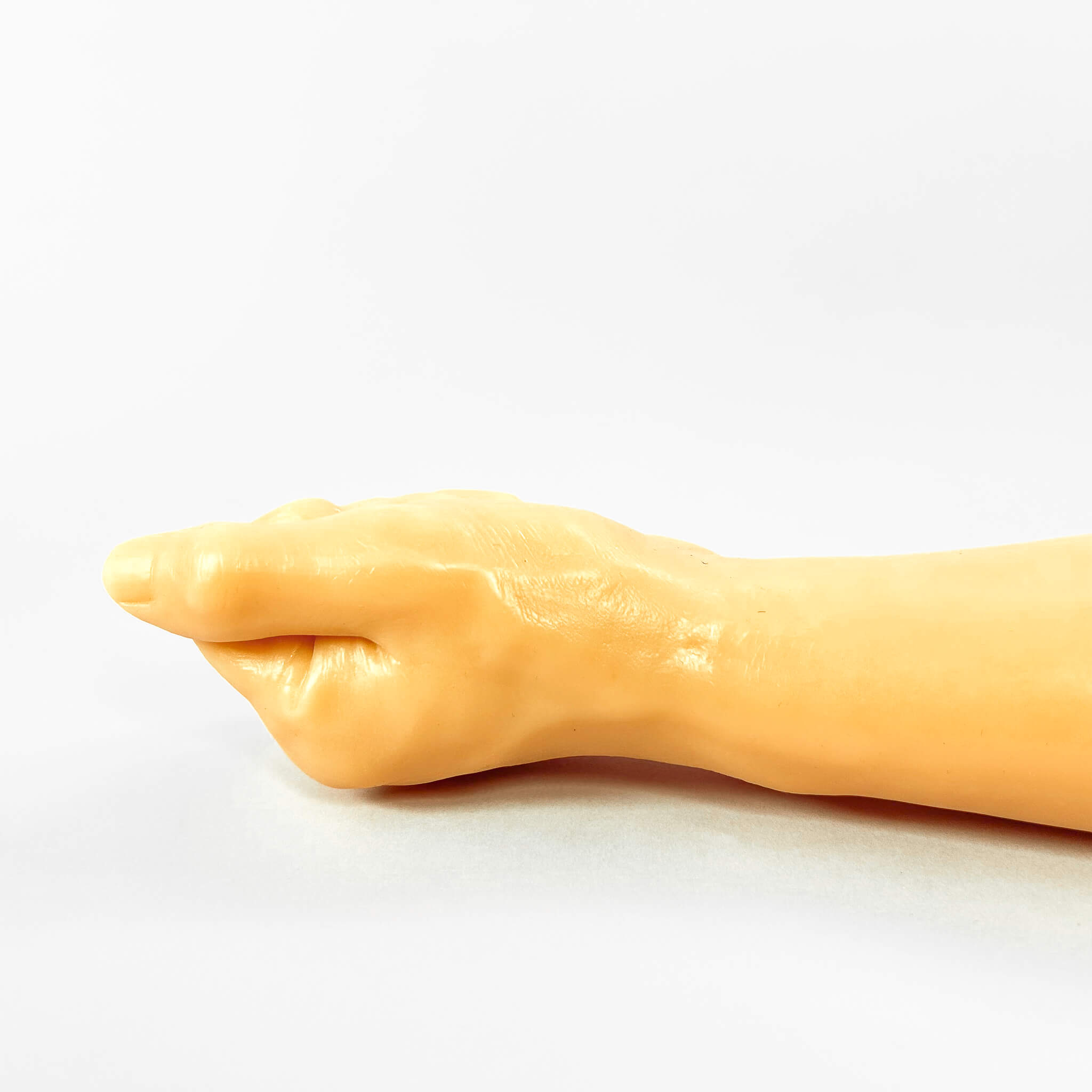 realistic fist dildo on a white background