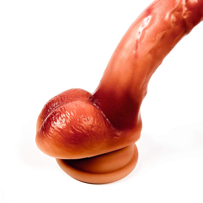 Close-up of a realistic silicone dildo on a white background