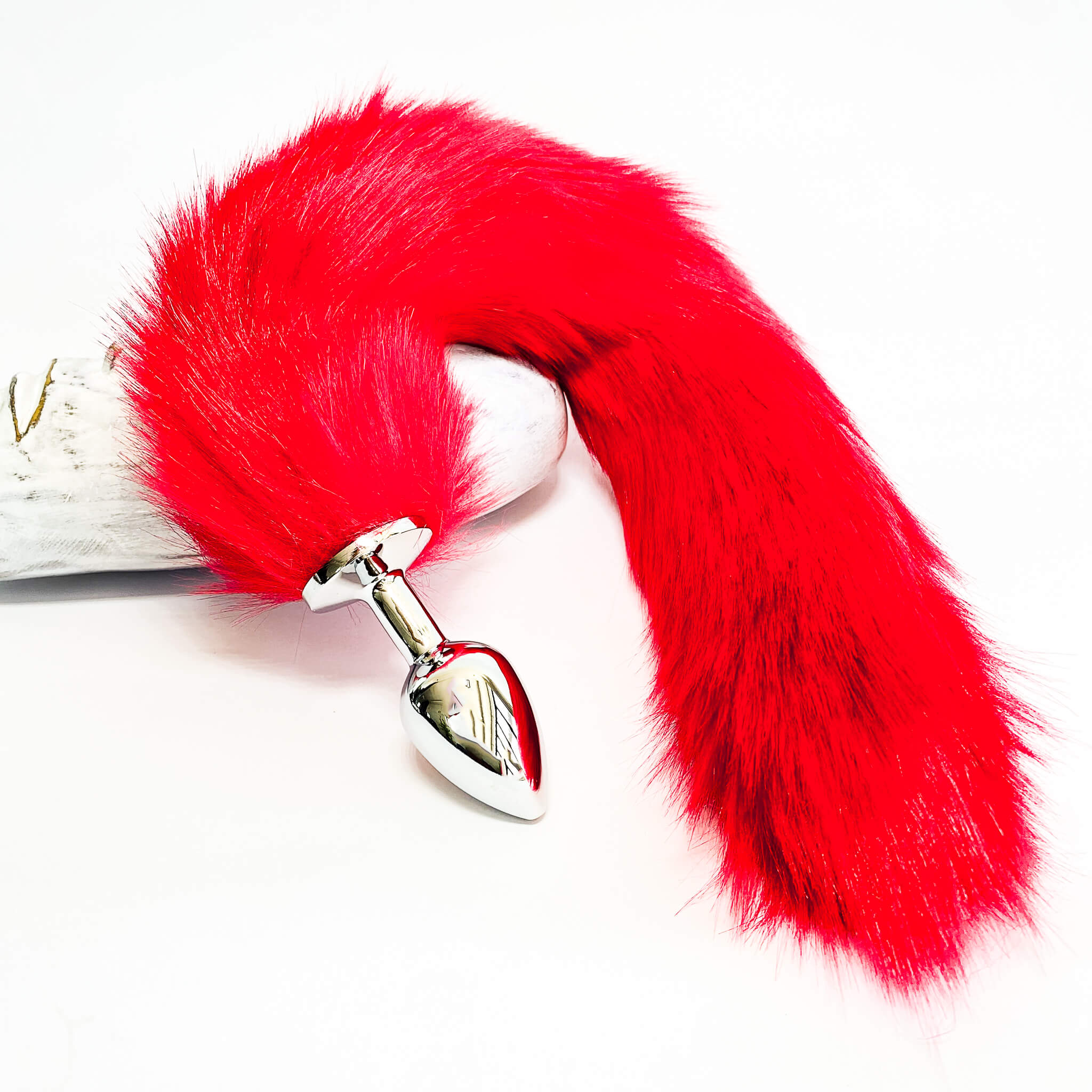 red buttplug with tails