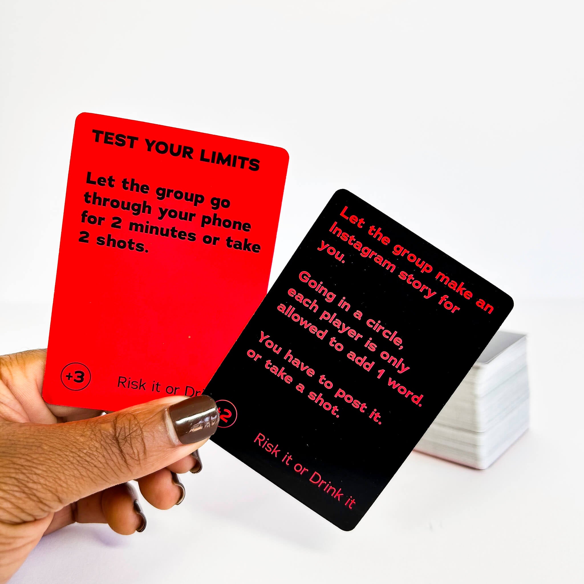 Two cards from a game with red and black text on a white background