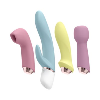 Set of four colorful handheld massagers with rose gold bases on a white background