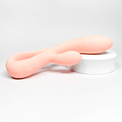 Pink silicone rabbit vibrator beginners on a light gray background