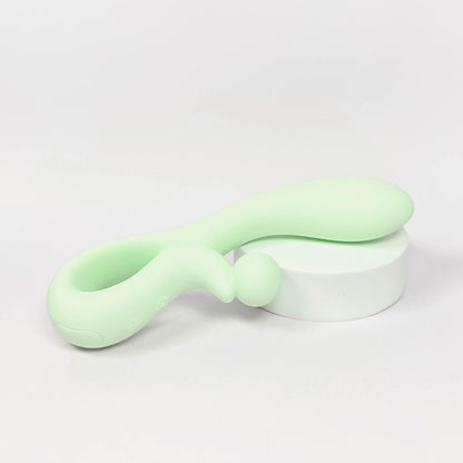 Light green silicone rabbit vibrator on a white background