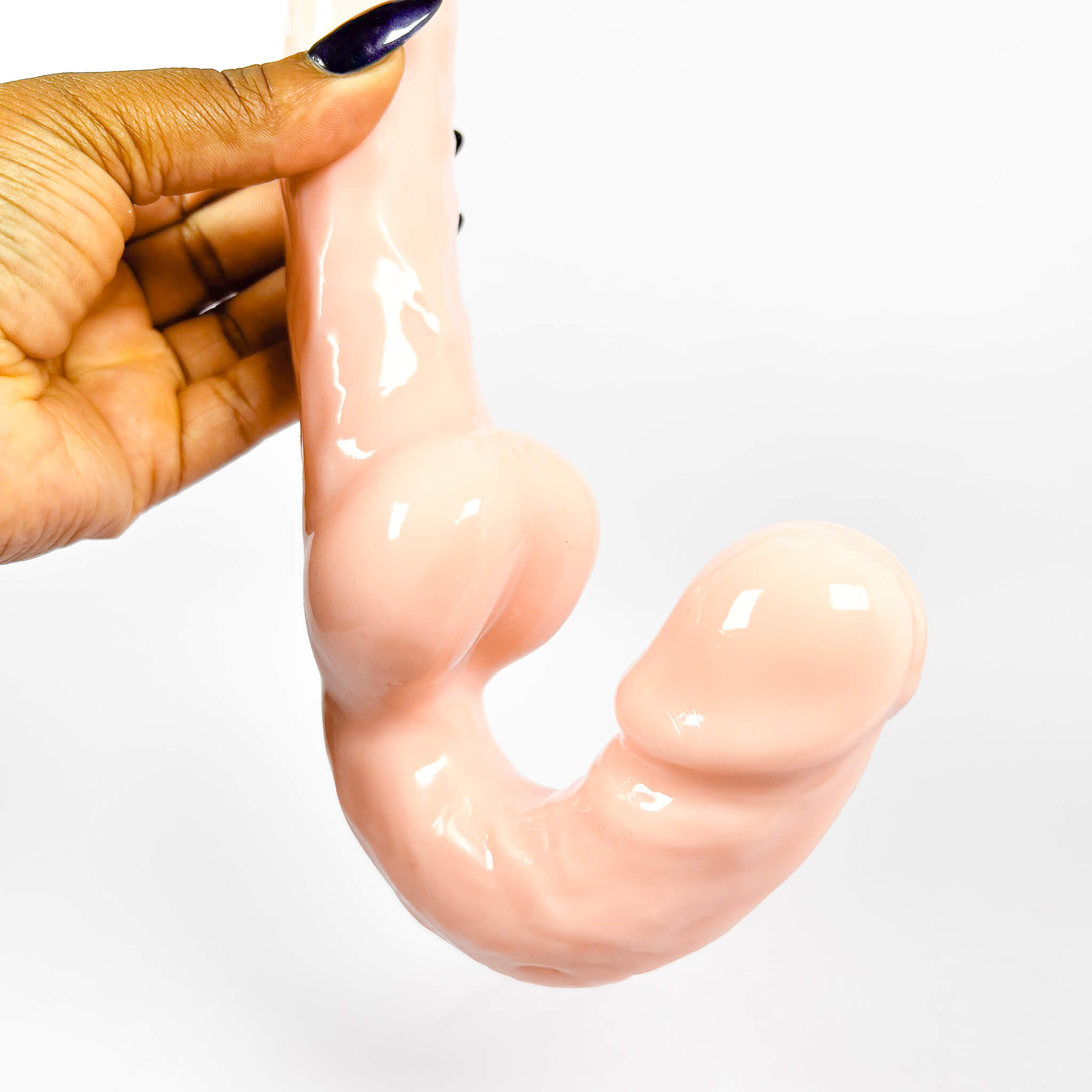 strapless double-ended dildo online against a white background
