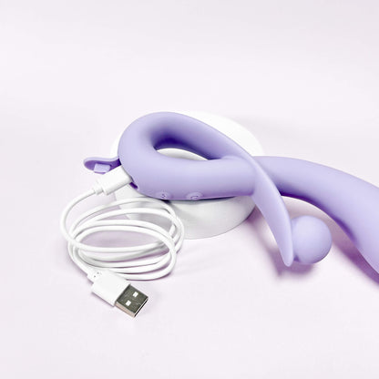 Purple usb rechargeable rabbit with USB cable on a white background