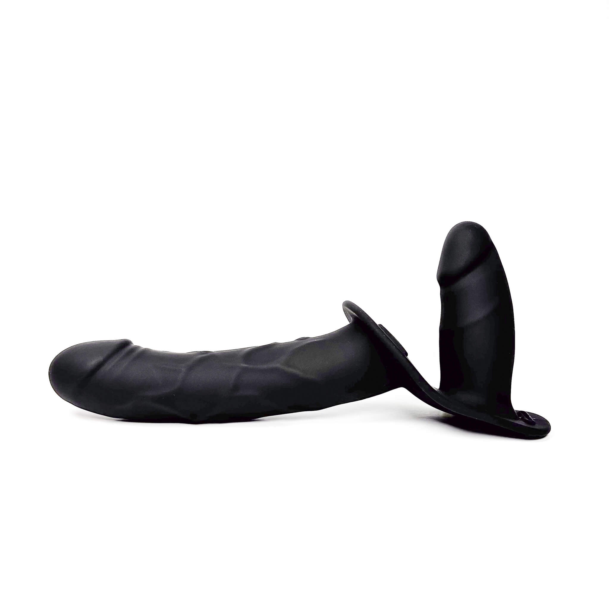 Black silicone dual-stimulation adult novelty device with a textured shaft and a separate curved insert, shown from a side profile on a white background.