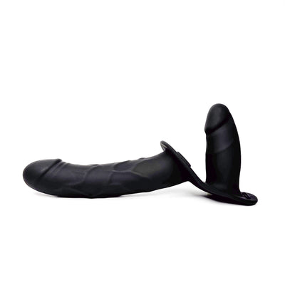 Black silicone dual-stimulation adult novelty device with a textured shaft and a separate curved insert, shown from a side profile on a white background.